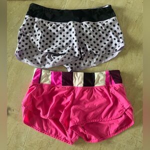 Two pairs of Lululemon shorts size 8. Purple black polkadot. Pink.